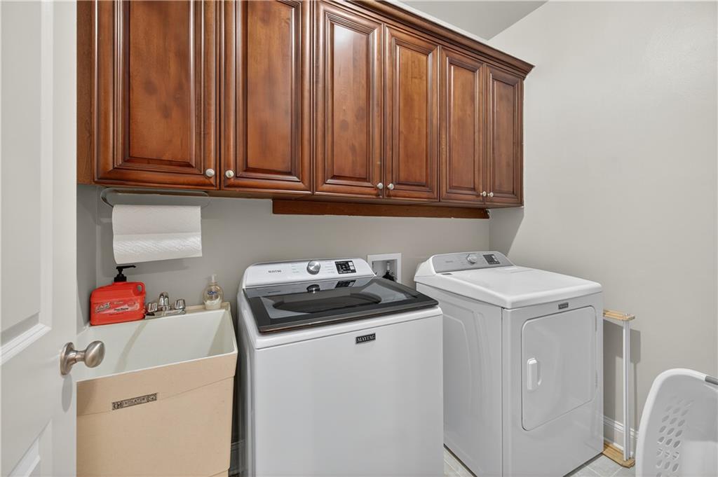 5250 Kendalls Way Cumming, GA 30041 - Photo 24 of 42 a utility room with dryer and washer