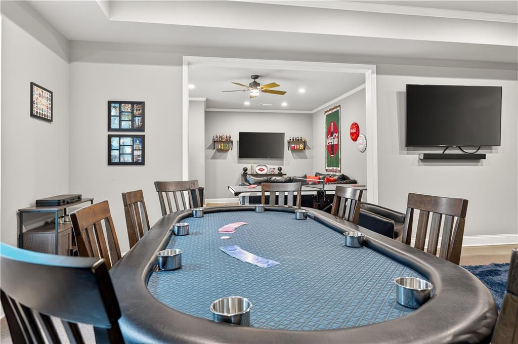 5250 Kendalls Way Cumming, GA 30041 - Photo 31 of 42 a view of a livingroom with furniture a flat screen tv and a window