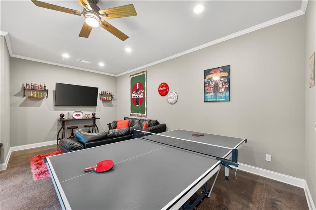 5250 Kendalls Way Cumming, GA 30041 - Photo 32 of 42 a room with furniture and a flat screen tv