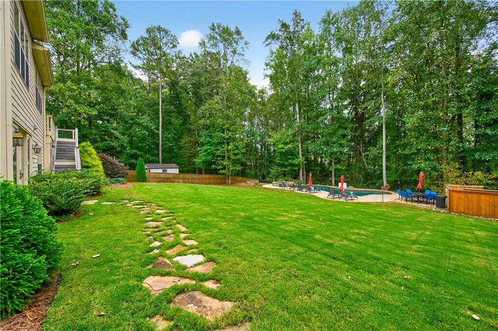 5250 Kendalls Way Cumming, GA 30041 - Photo 38 of 42 a view of a house with a backyard
