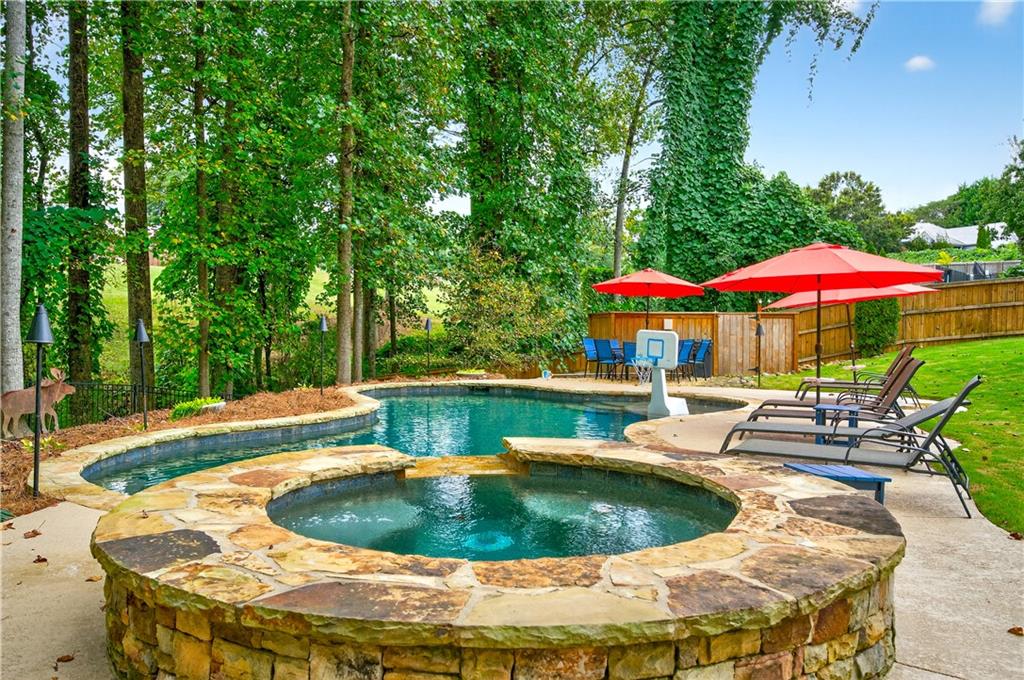 5250 Kendalls Way Cumming, GA 30041 - Photo 41 of 42 a view of a swimming pool with sitting area and furniture