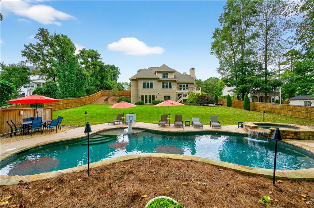5250 Kendalls Way Cumming, GA 30041 - Photo 42 of 42 a view of a house with a yard and sitting area