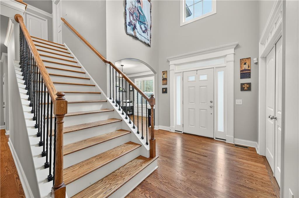 5250 Kendalls Way Cumming, GA 30041 - Photo 7 of 42 a view of entryway with wooden floor