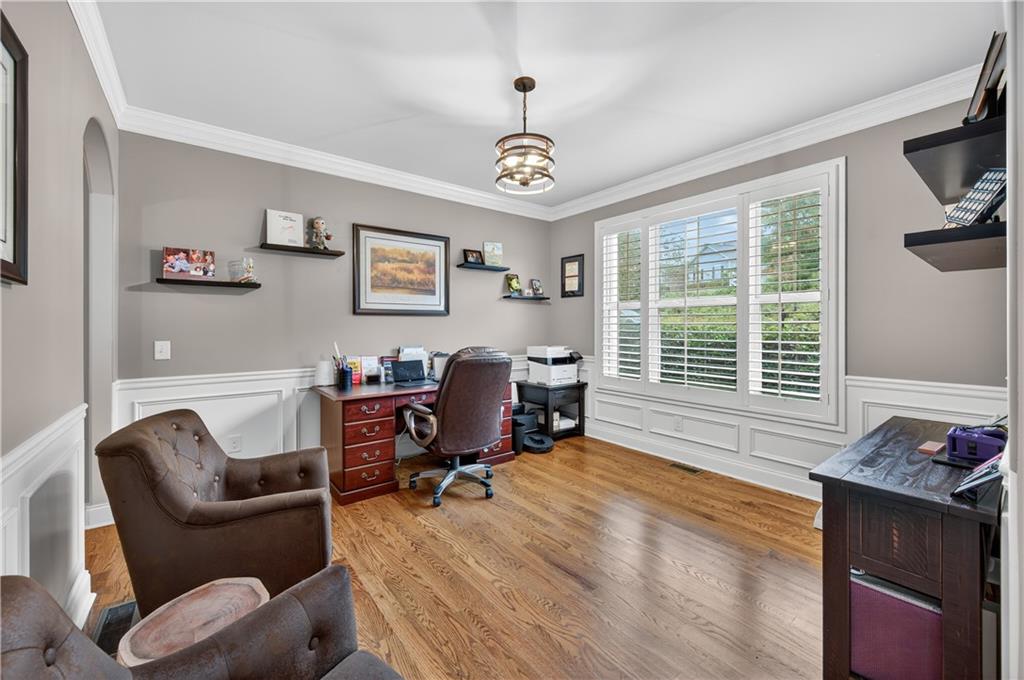 5250 Kendalls Way Cumming, GA 30041 - Photo 8 of 42 a living room with furniture a flat screen tv and a window