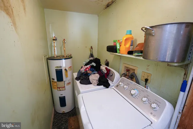a room with a refrigerator and washer