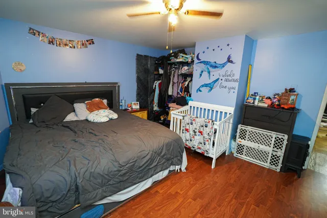 a bedroom with bed and a window