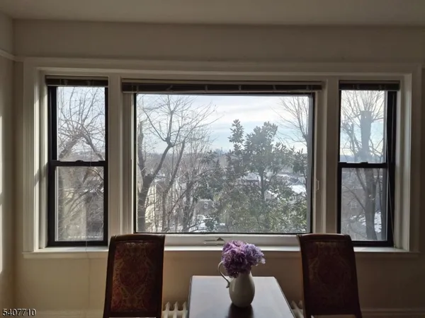 a view of a room with furniture and a window
