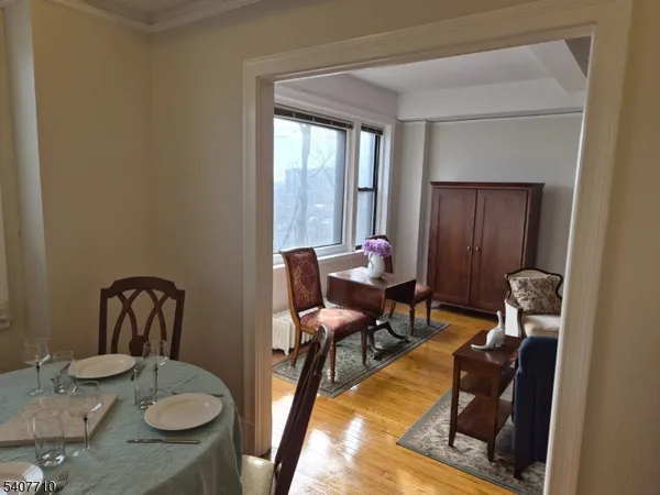 a view of a workspace with furniture and a table