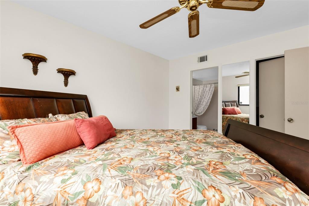 25225 Rampart Boulevard, Unit 1604 Punta Gorda, FL 33983 - Photo 18 of 41 a bedroom with a large bed and dresser