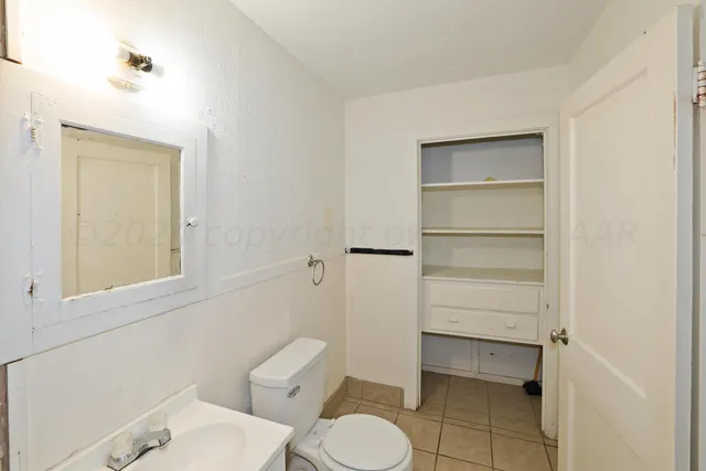 a bathroom with a toilet and a sink