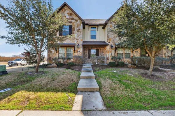 front view of a house with a yard
