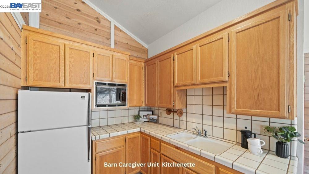 5280 Sheridan Road Sunol, CA 94586 - Photo 50 of 59 a bathroom with a granite countertop sink and a bathtub