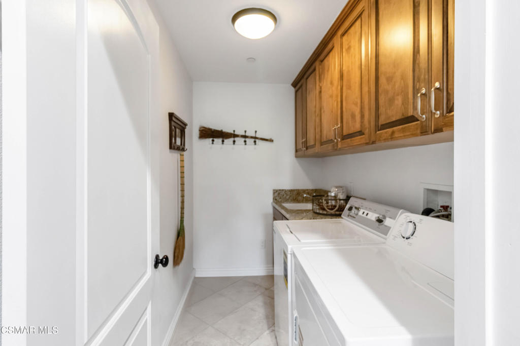 1308 Gonzales Road Simi Valley, CA 93063 - Photo 26 of 48 a utility room with dryer and washer