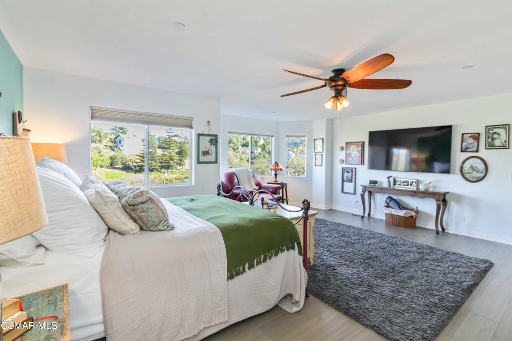 1308 Gonzales Road Simi Valley, CA 93063 - Photo 28 of 48 a bedroom with a bed and a flat screen tv