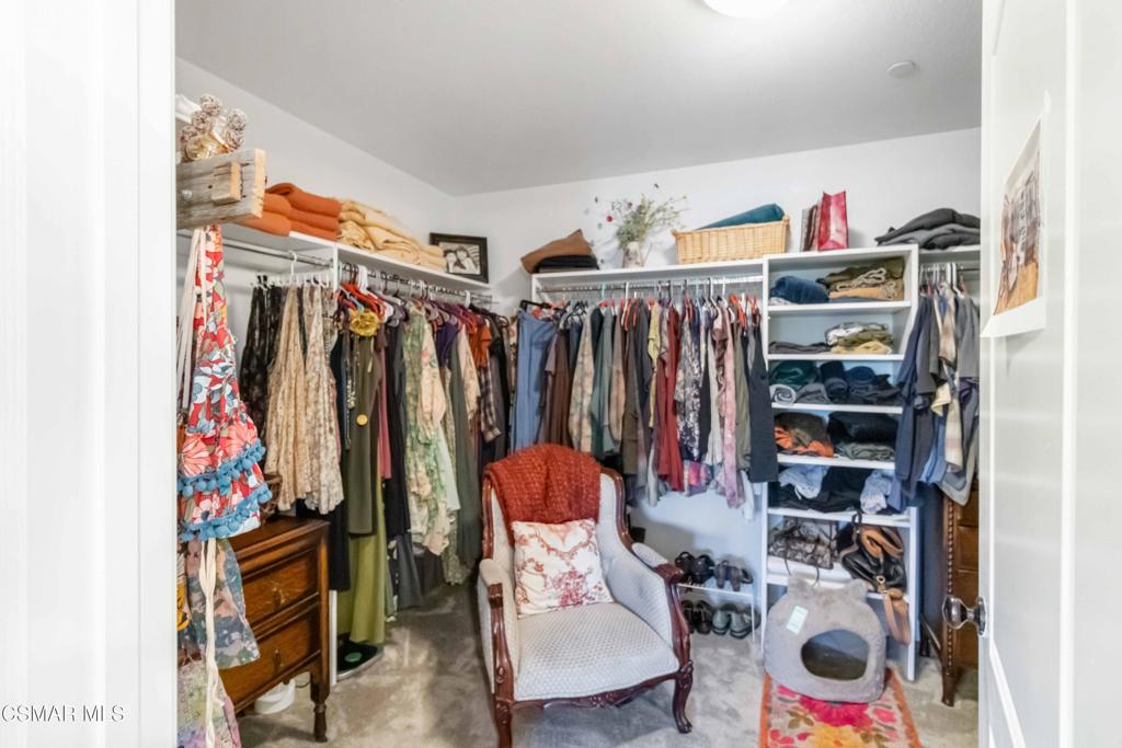 1308 Gonzales Road Simi Valley, CA 93063 - Photo 31 of 48 a view of walk in closet with clothes and shoes