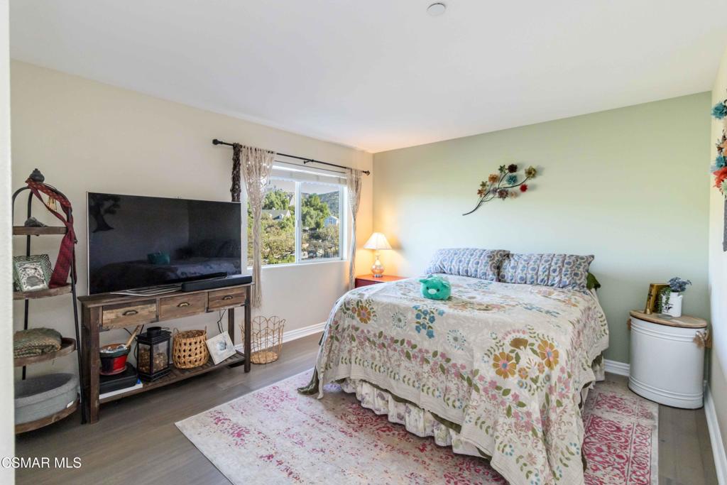 1308 Gonzales Road Simi Valley, CA 93063 - Photo 32 of 48 a bedroom with a bed and a flat screen tv
