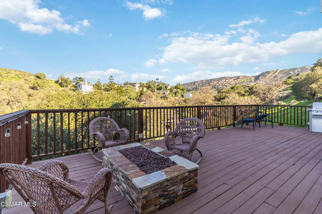 1308 Gonzales Road Simi Valley, CA 93063 - Photo 37 of 48 a view of a balcony with wooden floor and iron fence