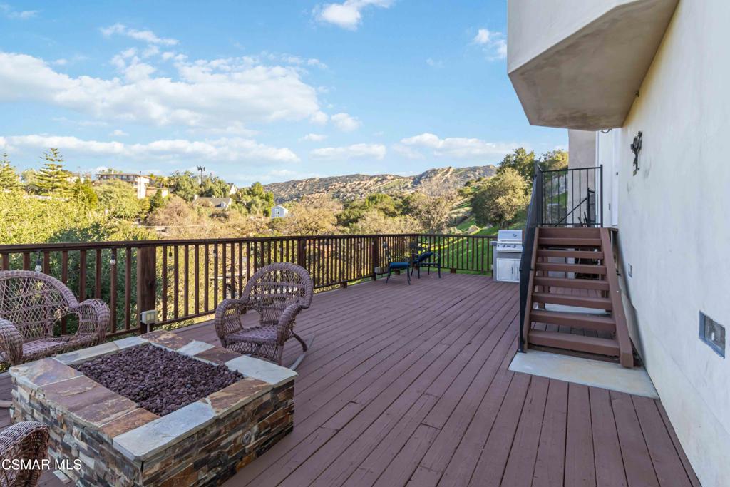 1308 Gonzales Road Simi Valley, CA 93063 - Photo 38 of 48 a view of terrace with wooden floor and seating space
