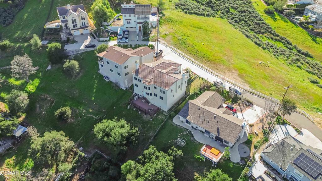 1308 Gonzales Road Simi Valley, CA 93063 - Photo 40 of 48 an aerial view of residential houses with outdoor space and swimming pool