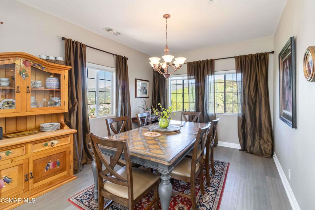 1308 Gonzales Road Simi Valley, CA 93063 - Photo 8 of 48 a view of a dining room with furniture window and wooden floor