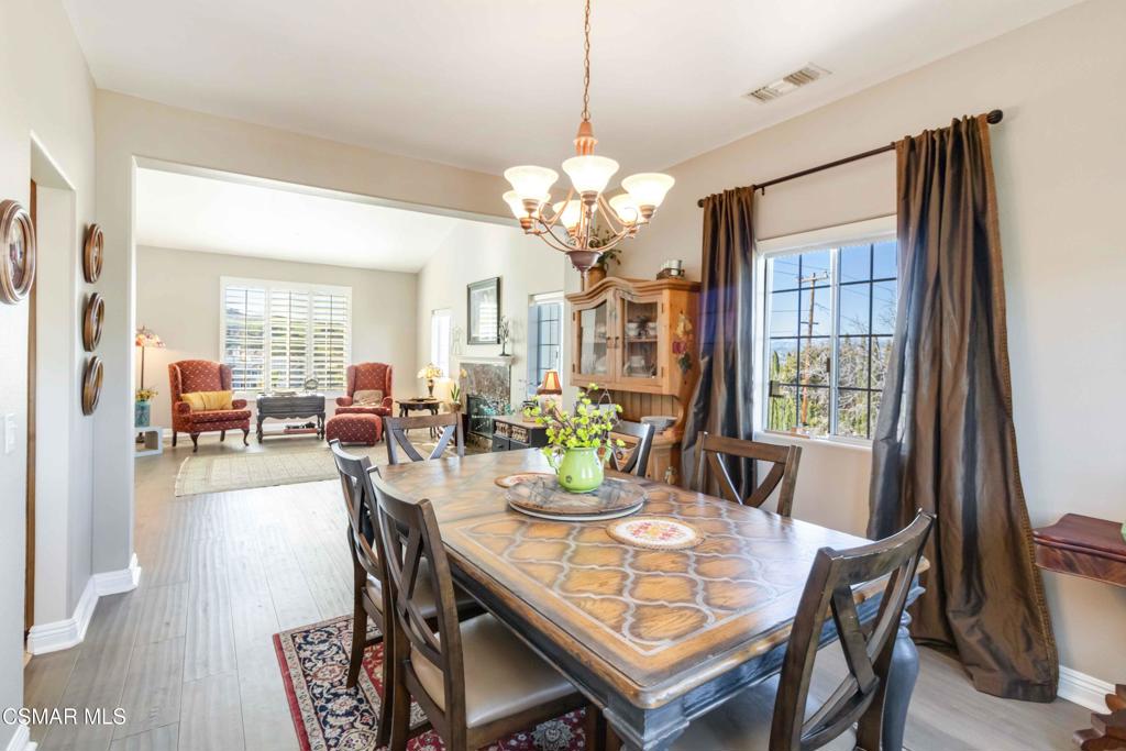 1308 Gonzales Road Simi Valley, CA 93063 - Photo 10 of 48 a view of a dining room with furniture window and wooden floor