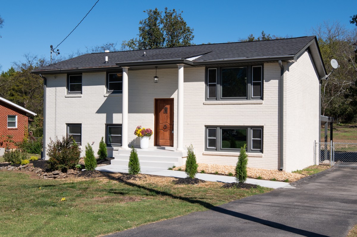 a front view of a house with garage