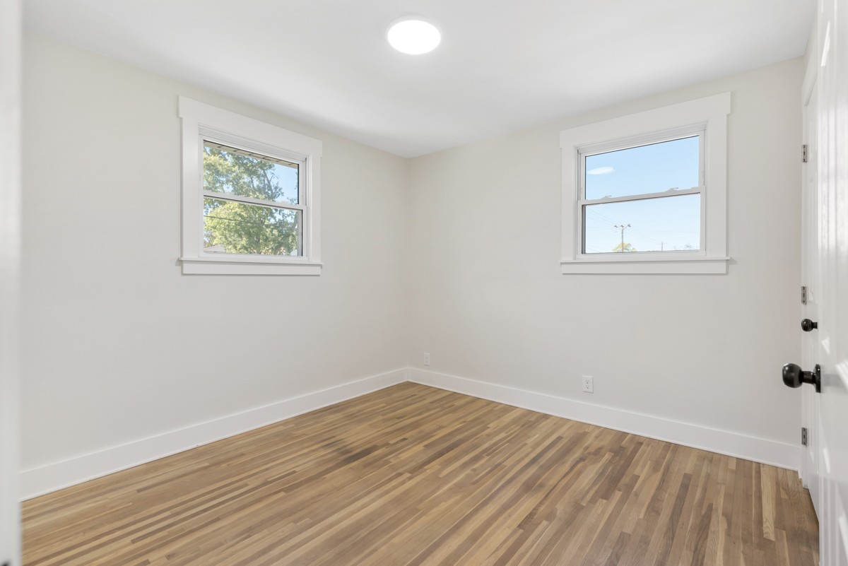 612 May Drive Madison, TN 37115 - Photo 19 of 46 an empty room with a window and wooden floor