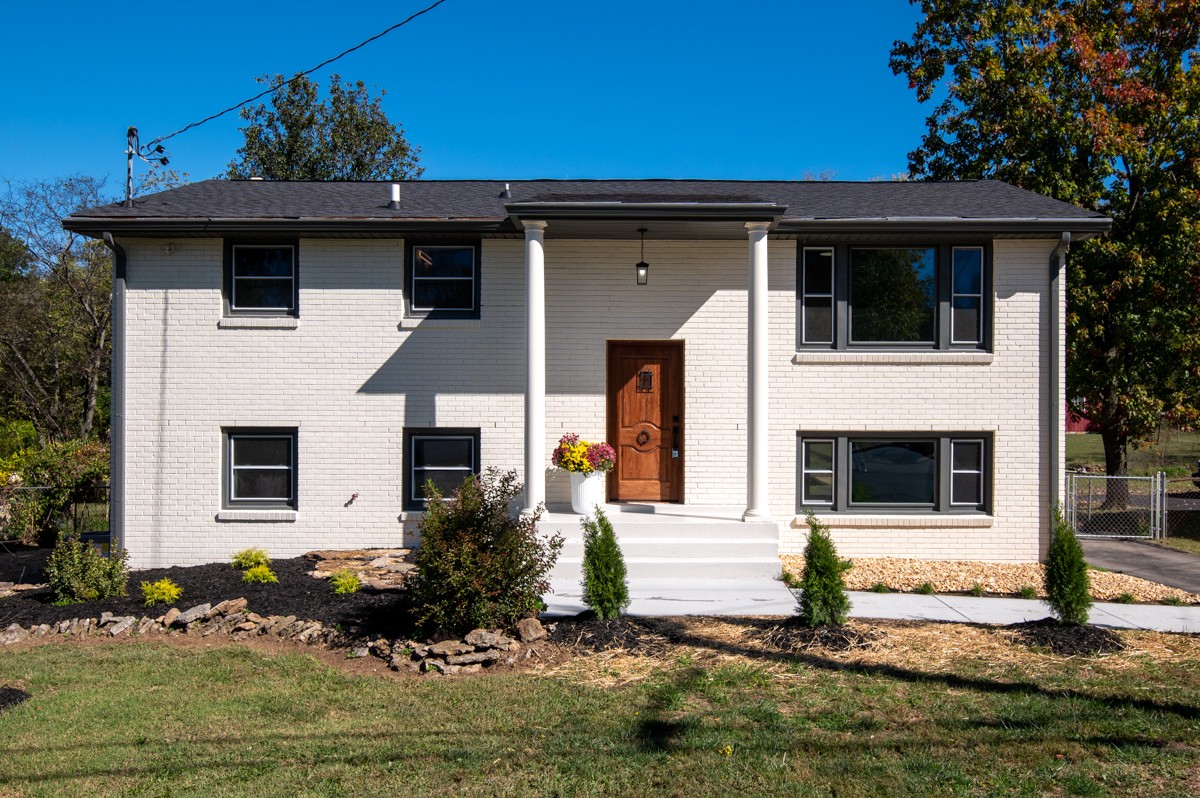 612 May Drive Madison, TN 37115 - Photo 2 of 46 a front view of a house with garden