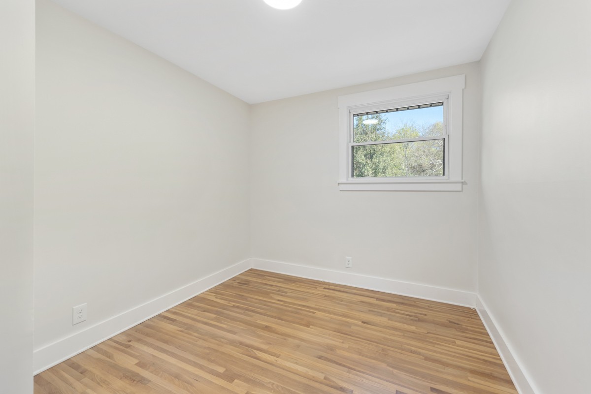 612 May Drive Madison, TN 37115 - Photo 24 of 46 a view of an empty room with wooden floor and a window