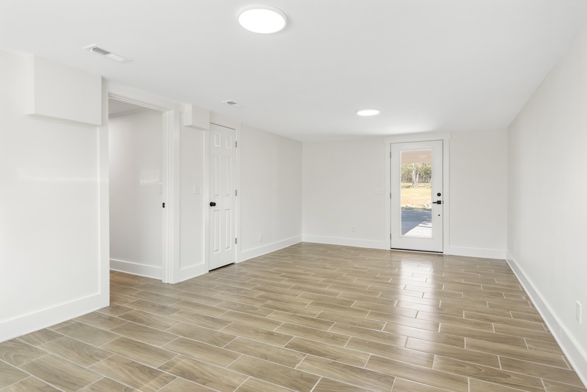 612 May Drive Madison, TN 37115 - Photo 31 of 46 a view of an empty room with wooden floor