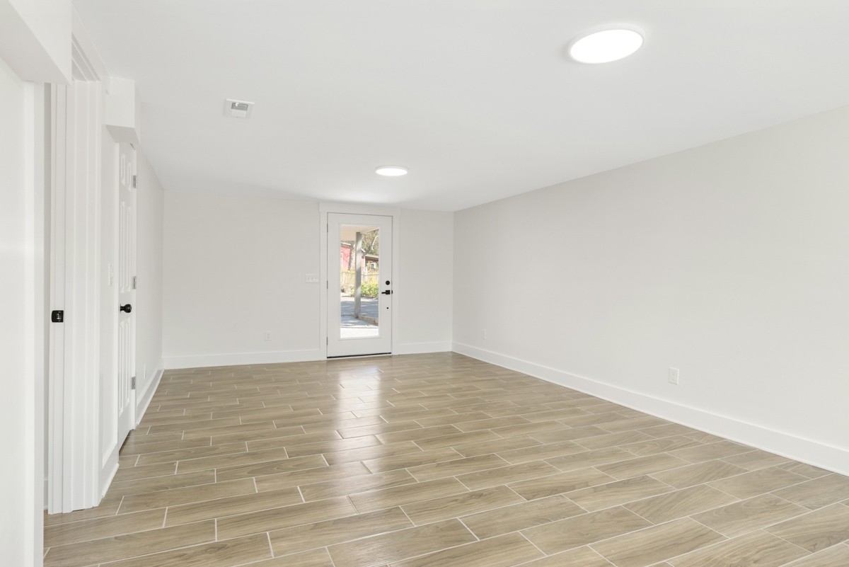 612 May Drive Madison, TN 37115 - Photo 32 of 46 a view of an empty room and wooden floor