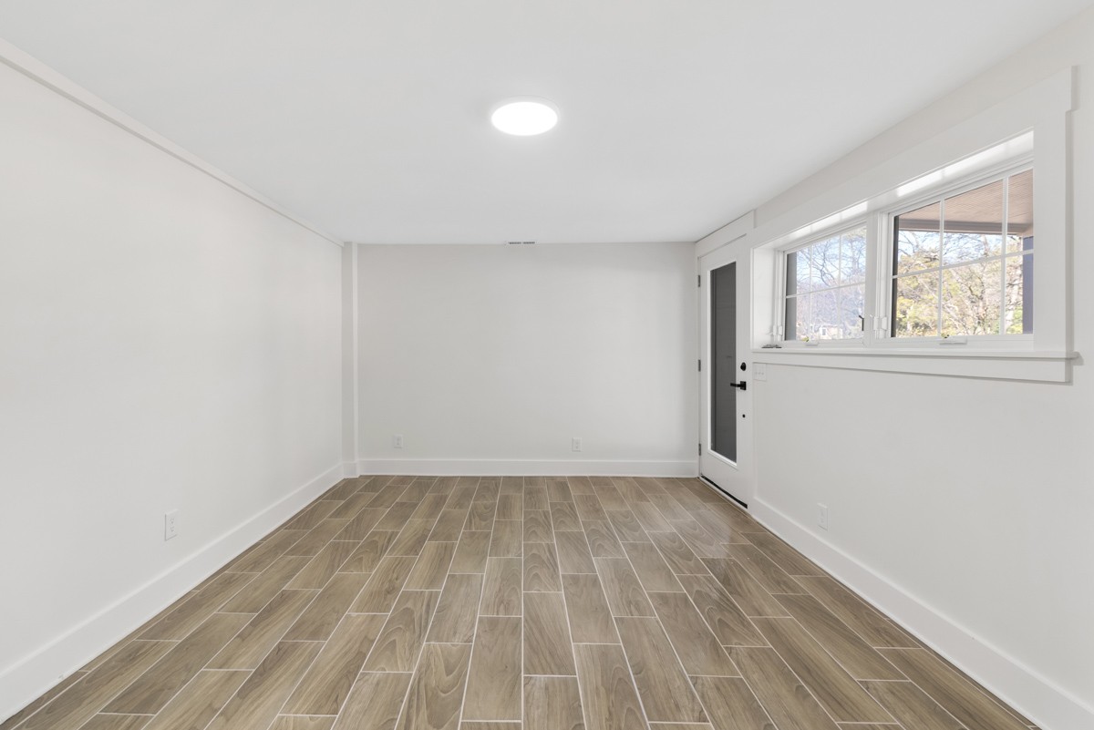 612 May Drive Madison, TN 37115 - Photo 33 of 46 an empty room with wooden floor and windows