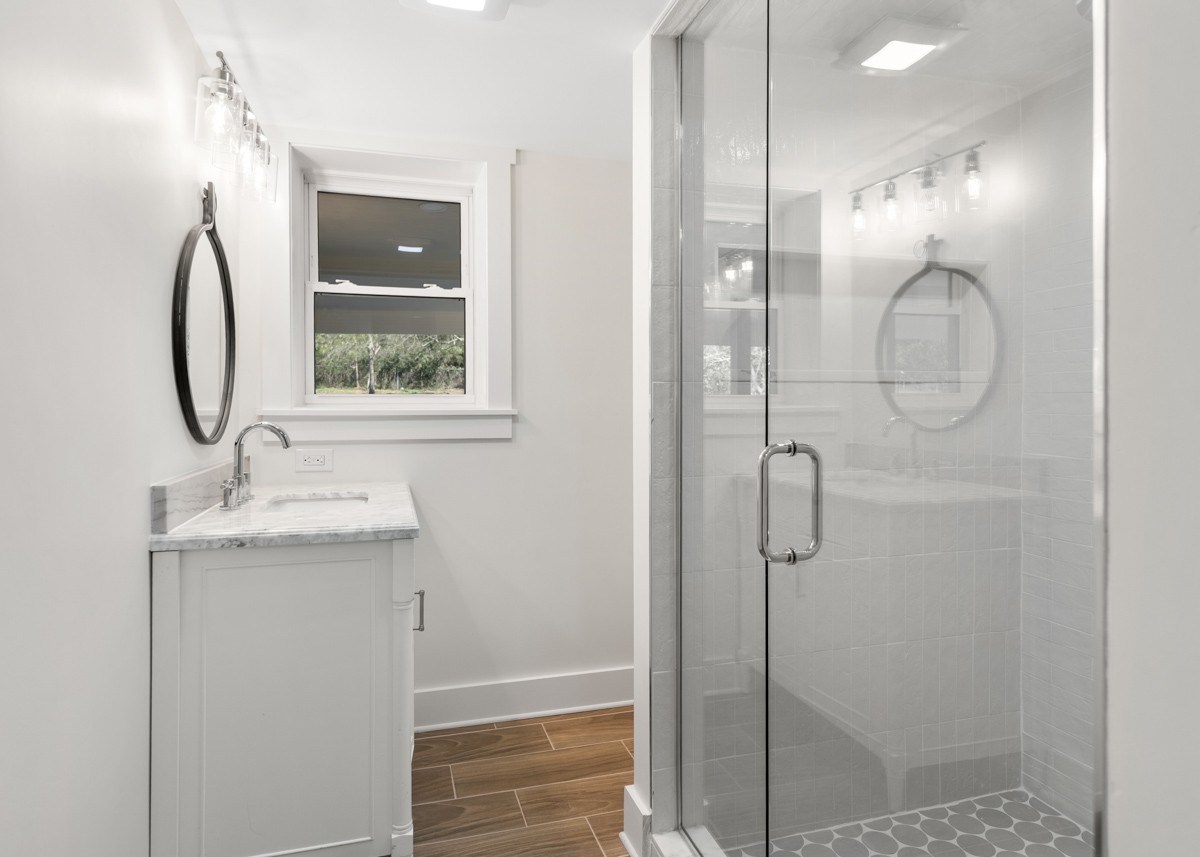 612 May Drive Madison, TN 37115 - Photo 36 of 46 a bathroom with a shower sink and mirror