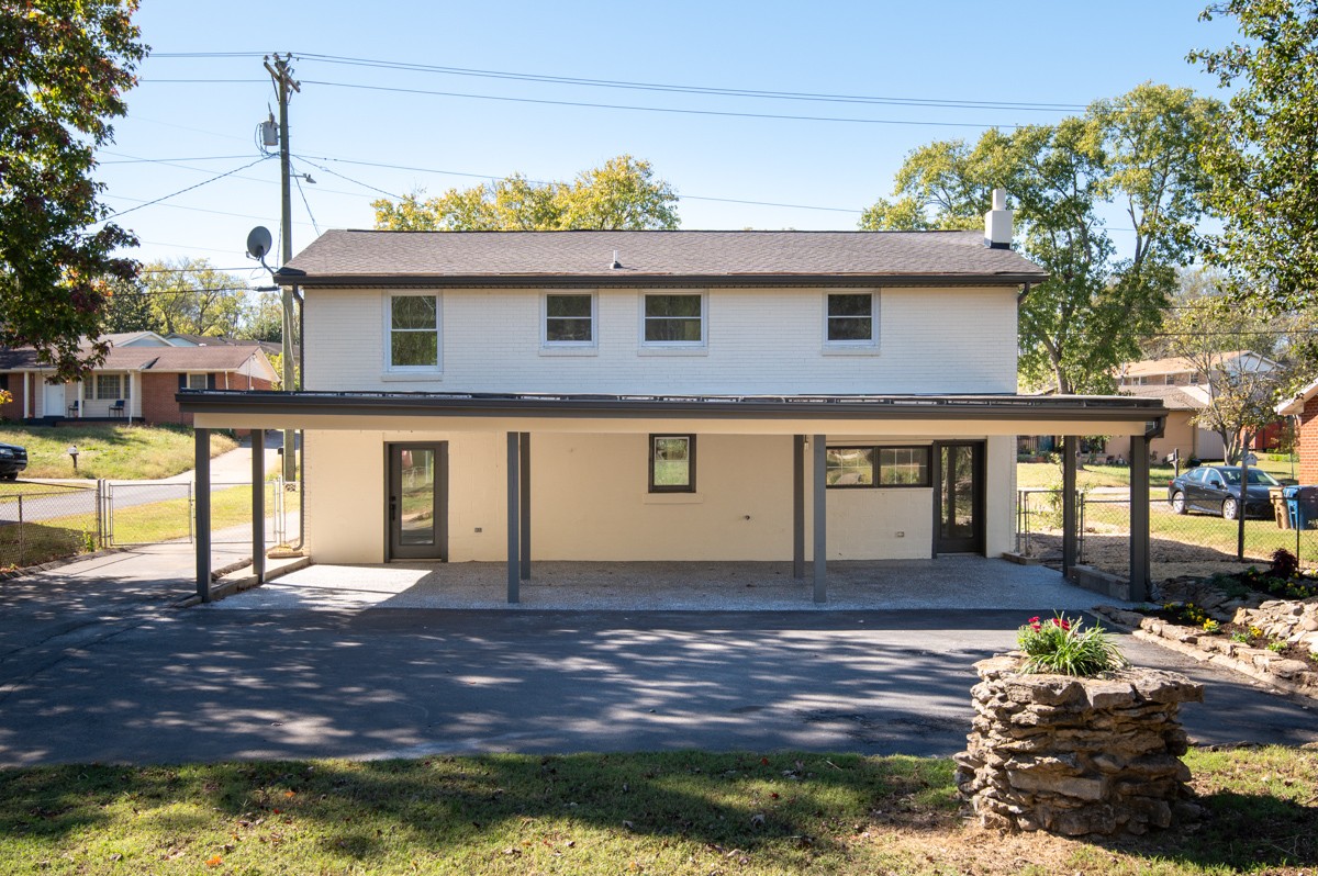 612 May Drive Madison, TN 37115 - Photo 38 of 46 a front view of a house with a yard and balcony