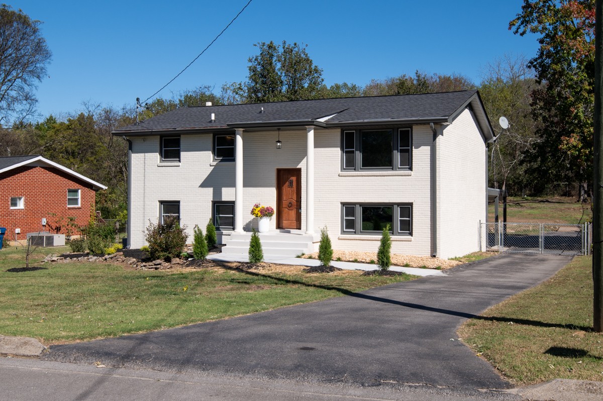 612 May Drive Madison, TN 37115 - Photo 4 of 46 a front view of a house with a yard