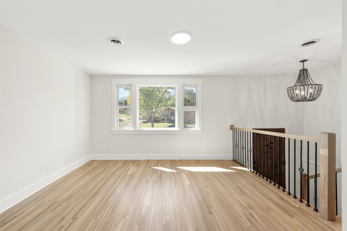 612 May Drive Madison, TN 37115 - Photo 9 of 46 wooden floor in an empty room with a window