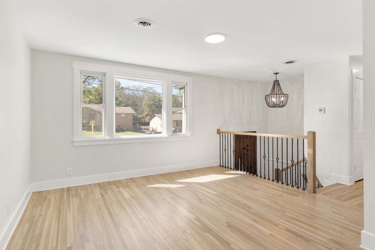 612 May Drive Madison, TN 37115 - Photo 10 of 46 a view of a room with wooden floor and windows