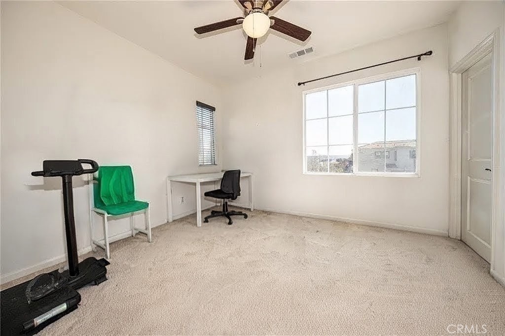 11811 Cramer Road Yucaipa, CA 92399 - Photo 43 of 56 a view of a workspace with furniture and a window