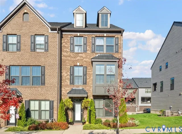a view of multiple houses with a street