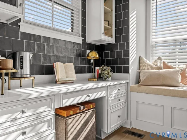 a kitchen with a sink and cabinets