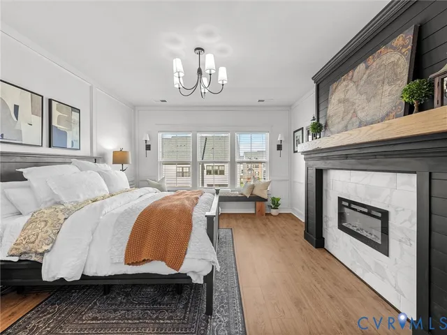 a bedroom with a bed and a fireplace