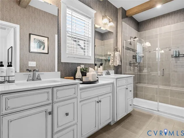 a bathroom with a sink vanity granite and a mirror