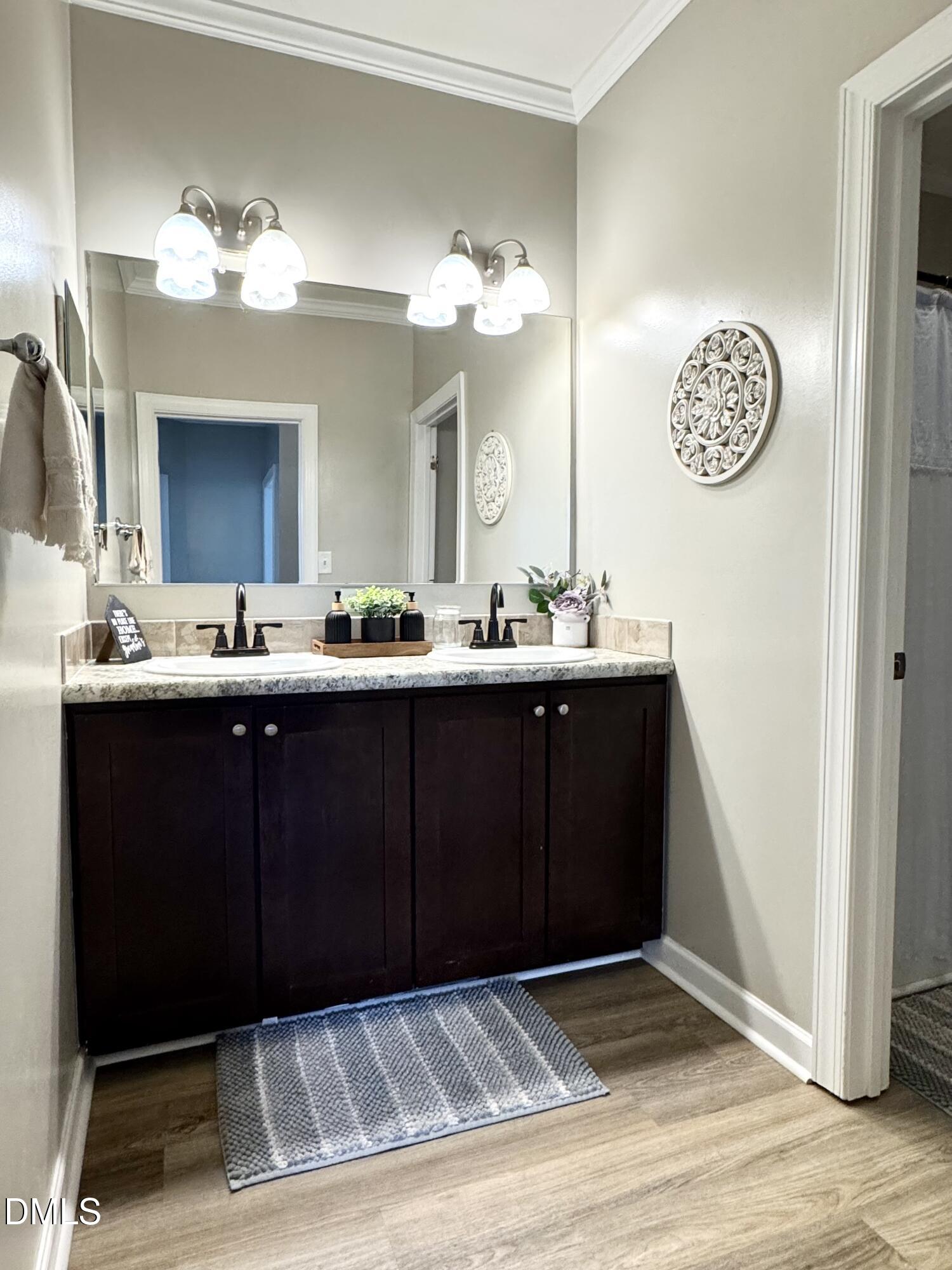 640 Tart Town Road Dunn, NC 28334 - Photo 27 of 71 a bathroom with a sink and a mirror