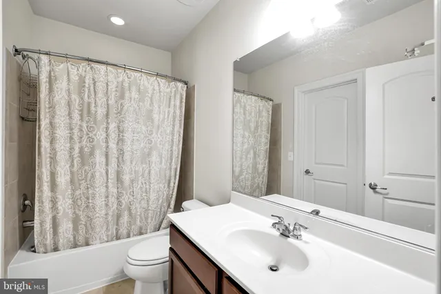 a workspace with wooden floor and a window