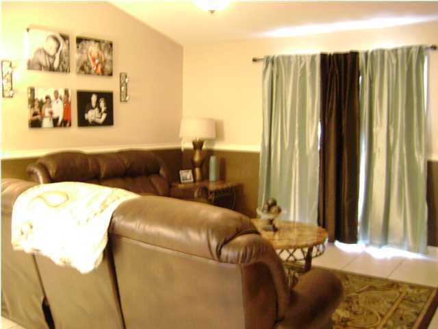 24270 Mcphail Farm Road Florala, AL 36442 - Photo 15 of 25 a living room with furniture and a large window