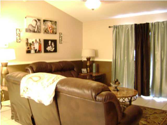 24270 Mcphail Farm Road Florala, AL 36442 - Photo 16 of 25 a living room with furniture and a large window