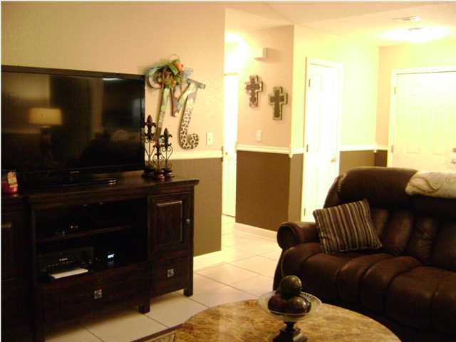24270 Mcphail Farm Road Florala, AL 36442 - Photo 17 of 25 a living room with furniture and a flat screen tv
