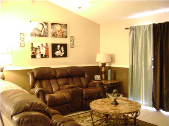 24270 Mcphail Farm Road Florala, AL 36442 - Photo 2 of 25 a living room with furniture and wooden floor