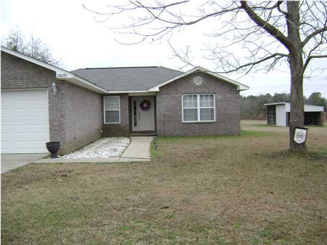 24270 Mcphail Farm Road Florala, AL 36442 - Photo 24 of 25 a house with trees in the background