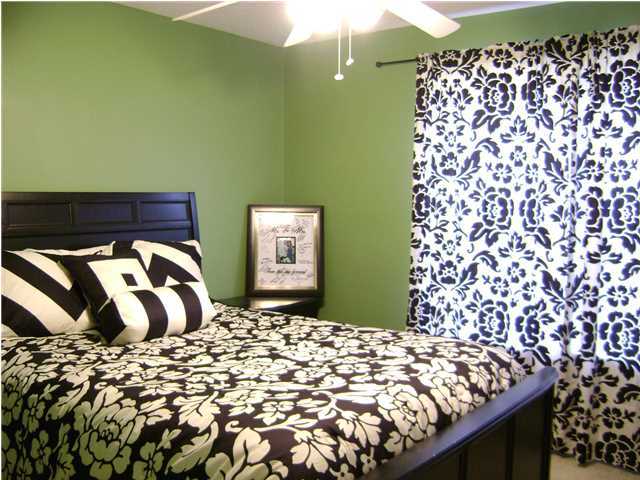 24270 Mcphail Farm Road Florala, AL 36442 - Photo 5 of 25 a bedroom with a bed and a painting on the wall